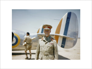Field Marshal Jan Smuts, Prime Minister of the Union of South Africa, standing in front of a Lockheed Lodestar aircraft of No. 234 Squadron SAAF.