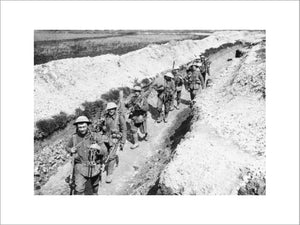 Men of the King's Liverpool Regiment carrying barbed wire picket posts along a communication trench near Blairville Wood, 16th April 1916.