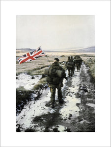 45 Royal Marine Commando marches towards Port Stanley during the Falklands War, 1982. Marine Peter Robinson carrys the Union Flag on his pack.
