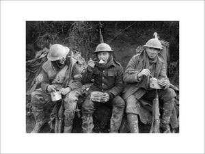 British soldiers eating hot rations in the Ancre Valley during the Battle of the Somme, October 1916.