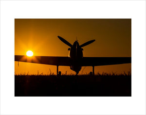 Hawker Hurricane moving to the runway at the Duxford Airfield during sunrise