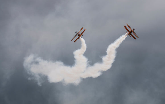 Two yellow Aero Super Batics Wingwalker in display at the summer airshow