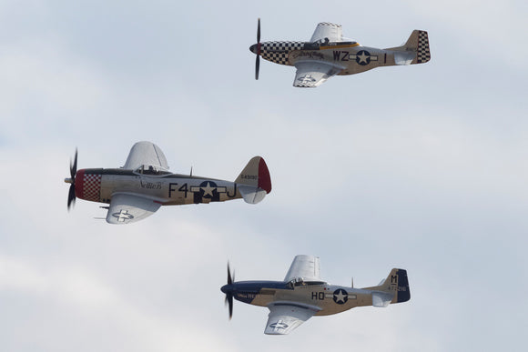 North American TF51D Mustang 'Contrary Mary', North American P-51D Mustang 'Miss Helen', and Republic P-47D Thunderbolt flying together