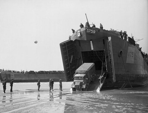 A lorry disembarks from a landing ship on the Normandy beaches, 7 June 1944.