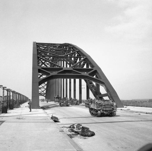 Universal carriers and lorries crossing the bridge at Nijmegen in Holland during Operation 'Market Garden', 21 September 1944.