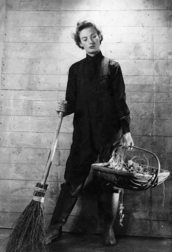 A Cecil Beaton portrait of a member of the Women's Royal Naval Service equipped for gardening duties.