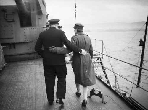Winston Churchill and his daughter Mary walking arm in arm aboard HMS DUKE OF YORK in the Clyde, shortly before the Prime Minister left for the United States, December 1941