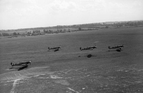 Supermarine Spitfire Mk VBs of No. 122 Squadron RAF take off from Hornchurch, Essex, for a fighter sweep over France, May 1942.