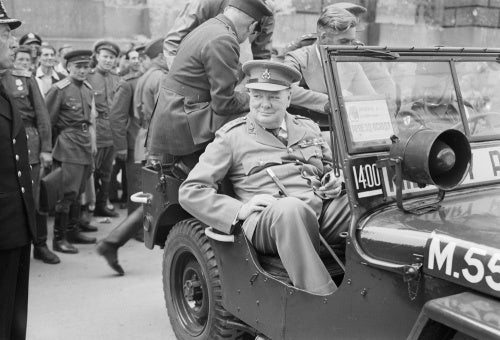 Winston Churchill in a jeep outside the German Reichstag during a tour of the ruined city of Berlin, 16 July 1945.