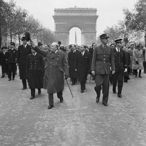 Winston Churchill and General Charles de Gaulle walk down the Avenue des Champs-Elysee duirng the French Armistice Day parade in Paris, 11 November 1944.