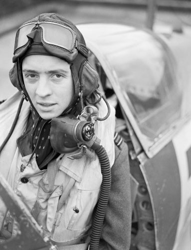 Wing Commander Richard 'Dickie' Milne in the cockpit of his Spitfire Mk IX at Biggin Hill, February 1943.