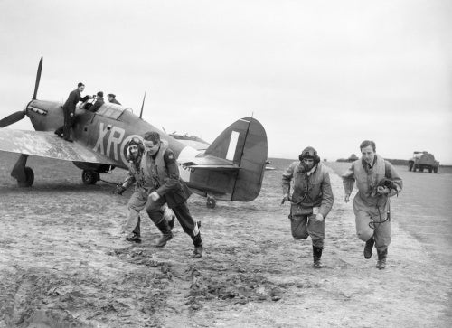 American pilots of No 71 'Eagle' Squadron rush to their Hawker Hurricanes at Kirton-in-Lindsey, 17 March 1941.