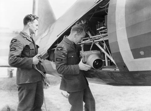 Groundcrew installing a Type F.24 camera into a Westland Lysander Mk II of No. 225 Squadron at RAF Tilshead, Wiltshire, September 1940.