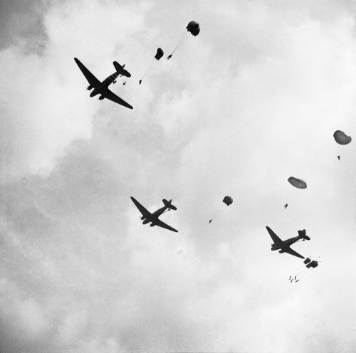 Paratroops drop from Dakota aircraft over the outskirts of Arnhem during Operation 'Market Garden', 17 September 1944.