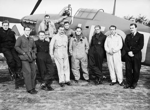 Squadron Leader Douglas Bader with pilots of No. 242 Squadron in front of his Hawker Hurricane at Duxford, September 1940.