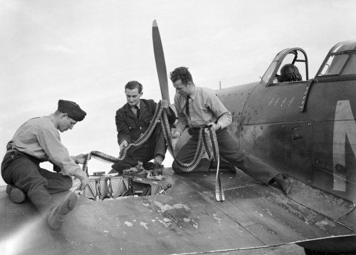 Armourers replenish the ammunition in a Hawker Hurricane Mk I of No. 310 (Czechoslovak) Squadron RAF at Duxford, Cambridgeshire, 7 September 1940.
