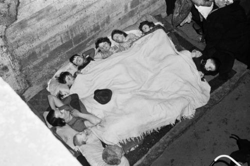 Members of the O'Rourke family sleeping in an air raid shelter under the railway arches in Bermondsey, London during November 1940.