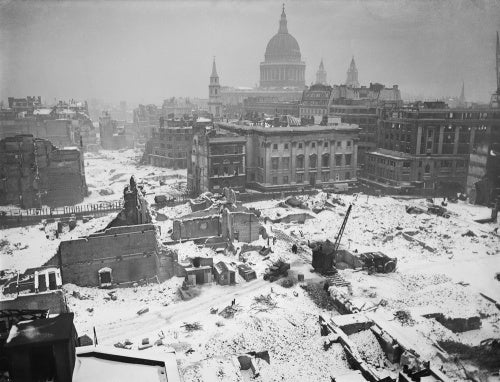 A winter scene of Bomb damaged buildings around St Paul's Cathedral, January 1942.