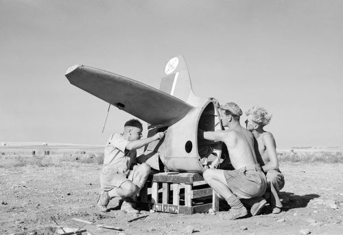 A party of riggers working on the tailplane of a Supermarine Spitfire of No. 601 Squadron at Lentini West, Sicily, 7 September 1943.