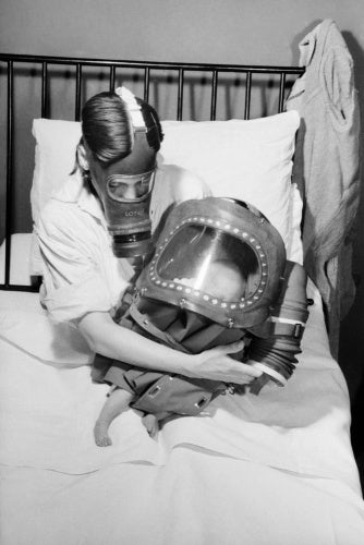A mother and baby both in gas-masks during 1941.