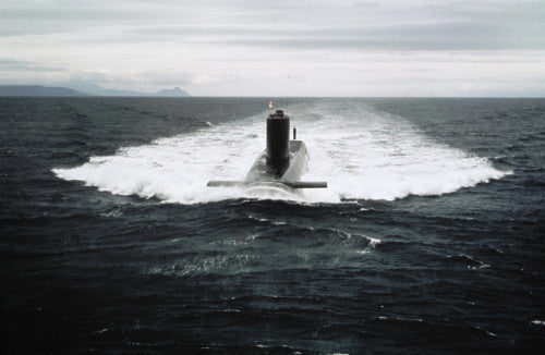 HMS RESOLUTION, the first nuclear-powered ballistic missile submarine to be equipped with Polaris missiles, seen underway on the surface probably off the Scottish coast c. 1970.