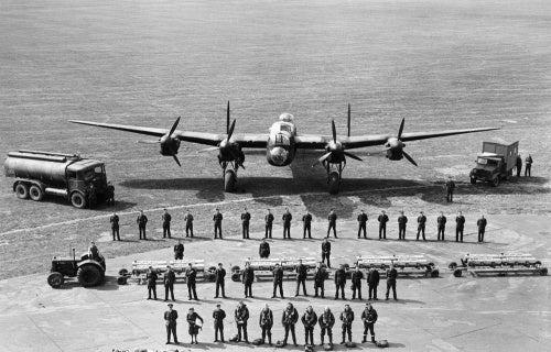 A graphic line-up of all the personnel required to keep one Avro Lancaster of RAF Bomber Command flying on operations, taken at Scampton, Lincolnshire, 11 June 1942.