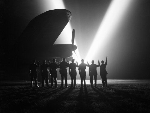 Ground staff at an RAF bomber station in Britain celebrate VE Day, 8 May 1945.