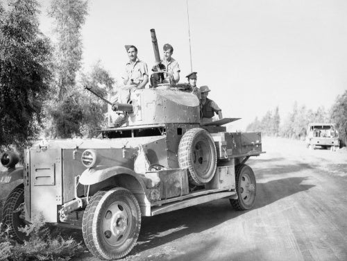 A Fordson Armoured Car of No. 2 Armoured Car Company RAF waits outside Baghdad, while negotiations for an armistice take place between British officials and the rebel government during the Iraqi Revolt, May 1941.