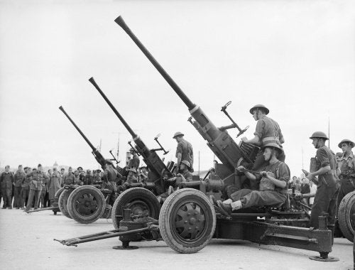 Royal Artillery 40mm Bofors guns being assembled on their arrival in Greece, 25 November 1940.