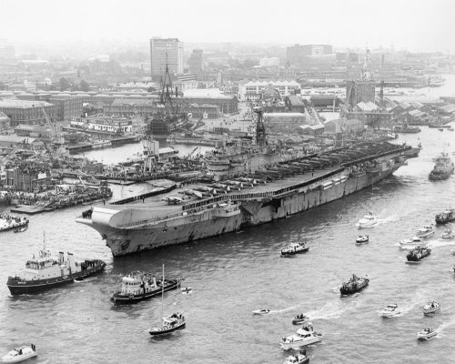 HMS HERMES about to berth at Portsmouth Harbour on her return from the Falkland Islands, 21 July 1982.