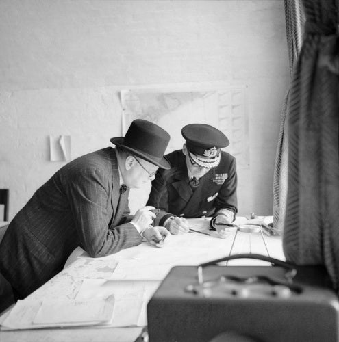 Winston Churchill studies after action reports with Vice Admiral Sir Bertram Ramsay, Flag Officer Comanding Dover, 28 August 1940.