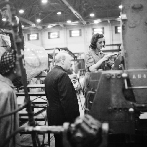 Winston Churchill watches a female riveter at work on a Supermarine Spitfire at the Castle Bromwich factory in Birmingham, 28 September 1941.