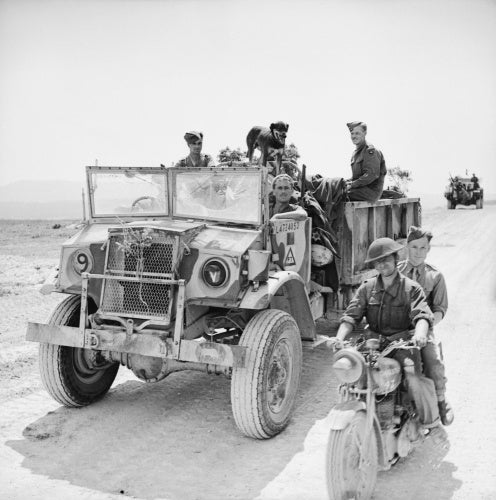 A CMP truck and motorcycle of 11th Royal Horse Artillery (Honourable Artillery Company), 1st Armoured Division, Tunisia, 22 April 1943.