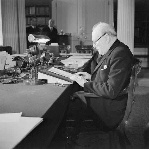 Winston Churchill at the microphone in the Cabinet Office, making his 'VE Day' broadcast to the nation, 8 May 1945.