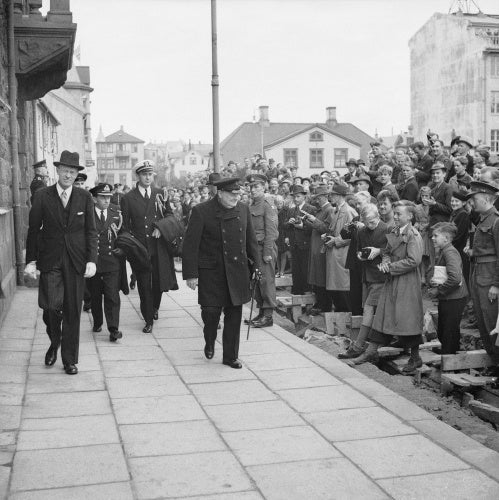 Winston Churchill being greeted by local people in Reykjavik, during his visit to Iceland on his way home from the Atlantic Conference with President Roosevelt, 19 August 1941.