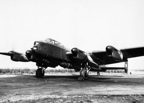 Avro Lancaster B Mk I (Special) of No. 617 Squadron, loaded with a 'Grand Slam' 22,000-lb deep-penetration bomb, running up its engines at Woodhall Spa, Lincolnshire, 1944.