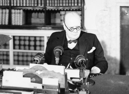Winston Churchill at a BBC microphone about to broadcast to the nation on the afternoon of VE Day, 8 May 1945.