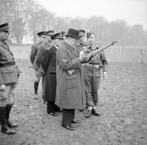 Winston Churchill inspects the new Lee-Enfield No. 4 Mk 1 rifle during a visit to 53rd Division in Kent, 20 November 1942.