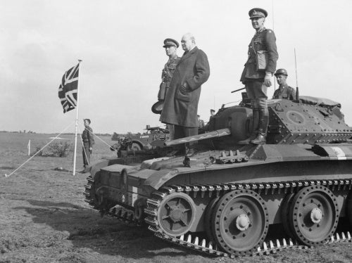Winston Churchill stands on a Covenanter tank of 4th/7th Royal Dragoon Guards, to take the salute at an  inspection of 9th Armoured Division near Newmarket, Suffolk, 16 May 1942.