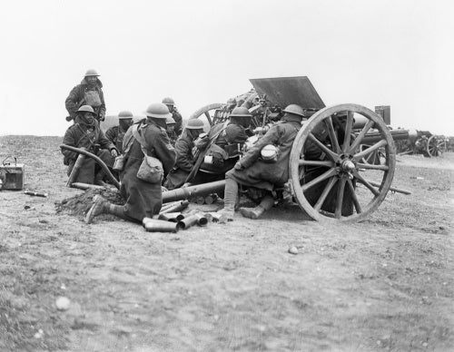 A battery of 18-pounder field guns of the Royal Field Artillery in action near the town of Albert on the Somme, 28 March 1918.