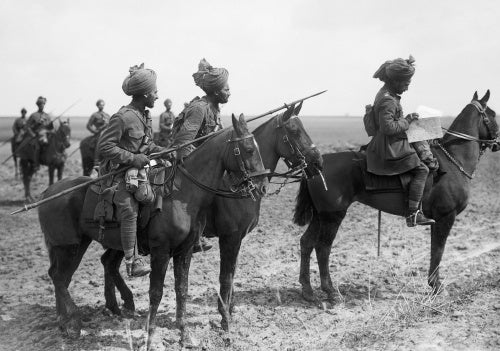 Forward scouts of the 9th Hodson's Horse, an Indian cavalry regiment, pause to consult a map, near Vraignes, April 1917.