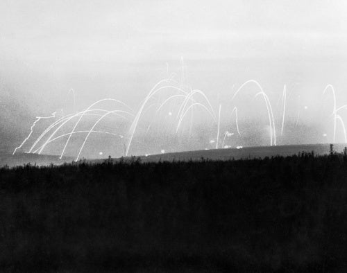 The dawn sky is lit by the bombardment before the assault on Thiepval, 15 September 1916, during the Battle of the Somme.