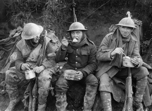 British soldiers eating hot rations in the Ancre Valley during the Battle of the Somme, October 1916.