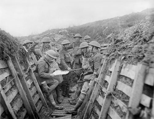 Officers of 1/7th Battalion, King's Liverpool Regiment checking a map in trenches of the La Bassee Canal sector, 28 February 1918.