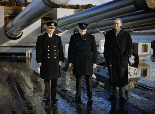 Winston Churchill with the Lord Privy Seal, Sir Stafford Cripps, and the Commander-in-Chief Home Fleet, Admiral Sir John Tovey, on the quarterdeck of HMS KING GEORGE V at Scapa Flow, 11 October 1942.
