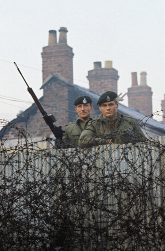 2nd Lieutenant Robin Martin and Rifleman Andy Walker of 1st Royal Green Jackets man a street barricade in Belfast during the Battalion's first tour of duty in Northern Ireland, 1969.