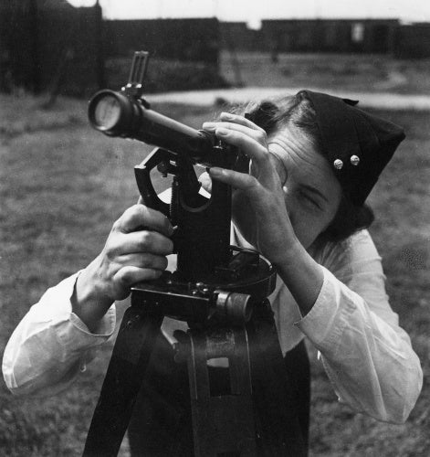 An ATS artillery observer uses a theodolite to measure air shell bursts at the Royal Artillery Experimental Unit, Shoeburyness, Essex , 1942