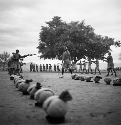 Having removed their turbans, Muslim and Hindhu Sikh police recruits are instructed in drill at a Frontier Constabulary training establishment, Nowshera,  Khyber Pakhtunkhwa Province, India, 1944