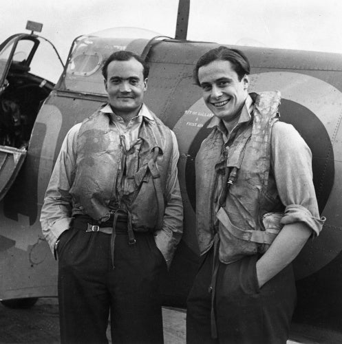 Two Battle of Britain fighter pilots, Flight Lieutenant  Brian Kingcome (left), commanding officer of No 92 Squadron RAF and his wingman, Flying Officer Geoffrey Wellum, next to a Spitfire at RAF Biggin Hill, Kent, 1941
