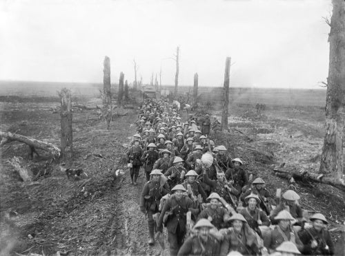 Men of The Sherwood Foresters marching along the Amiens-St. QuentinRoad, near Brie, March 1917.